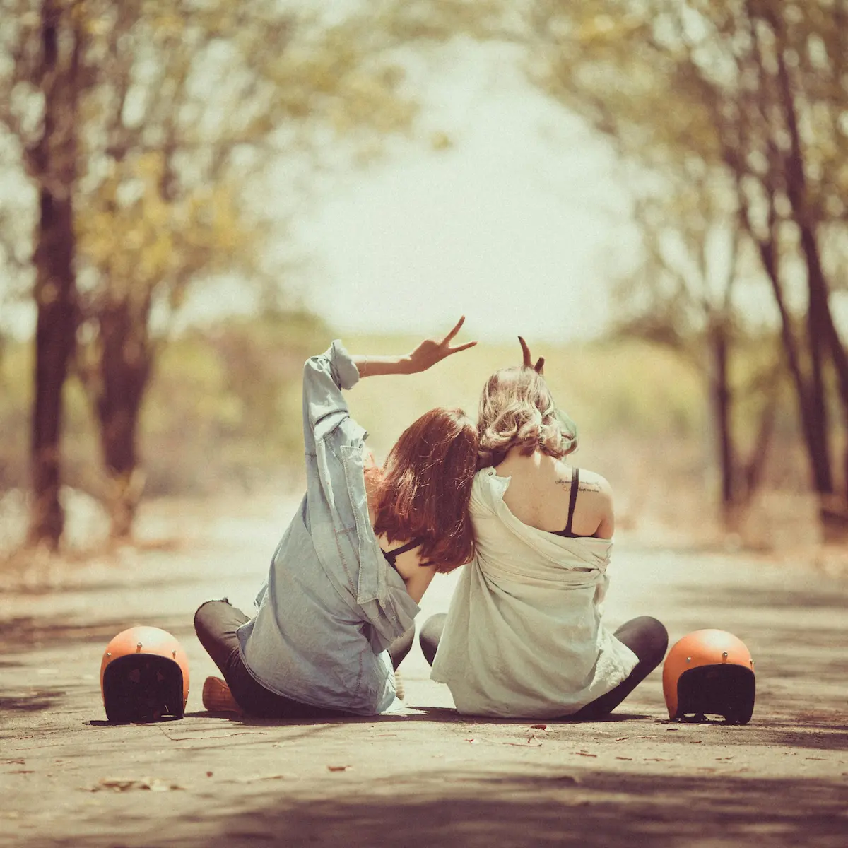two friends sitting side by side